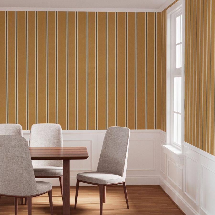 Warm orange Nantucket Linen Textured Stripe wallpaper in a dining room with a wooden table, upholstered chairs and white wall panelling.
