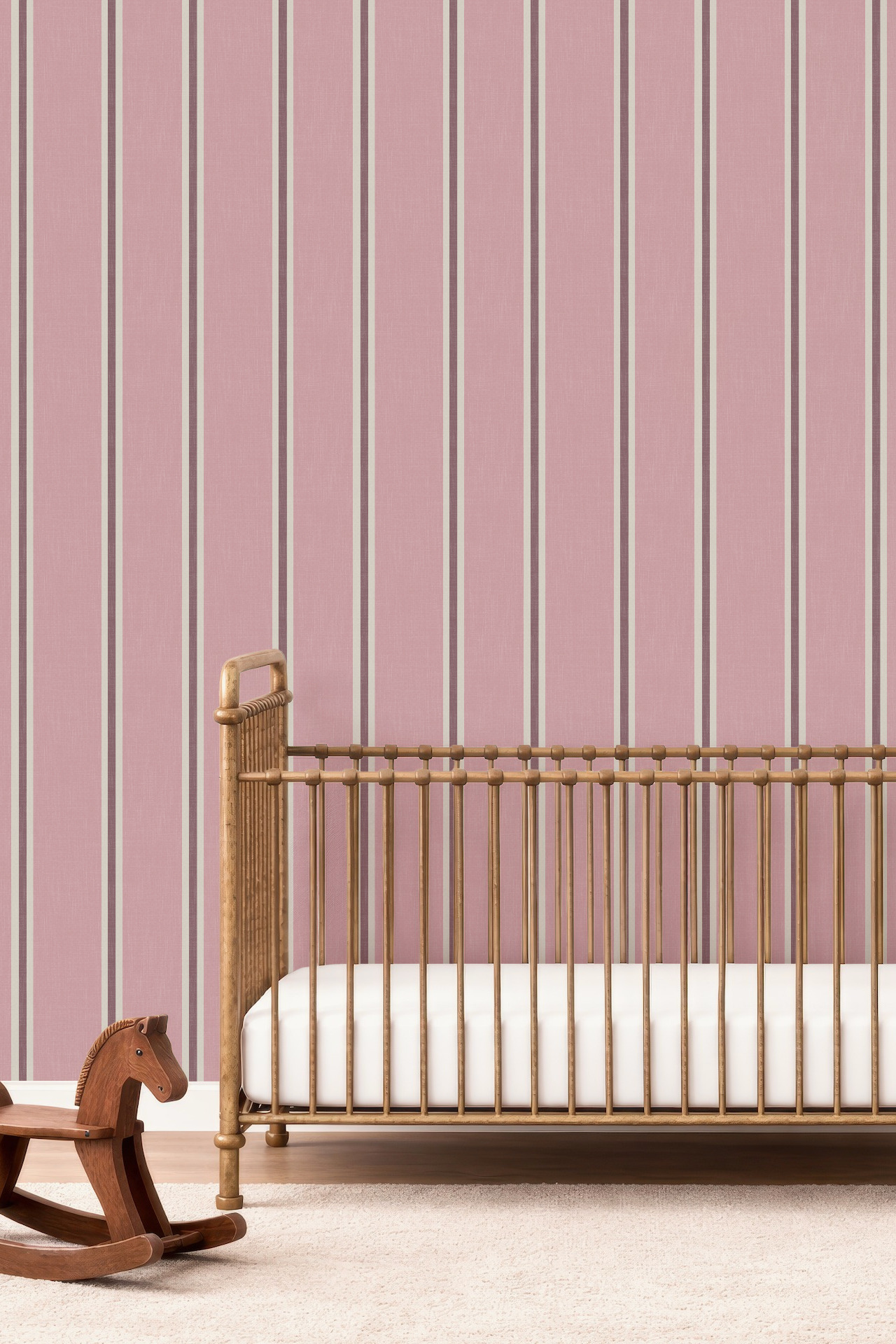 Pink Nantucket Linen Textured Stripe wallpaper with fine contrasting vertical stripes behind a wooden nursery crib.