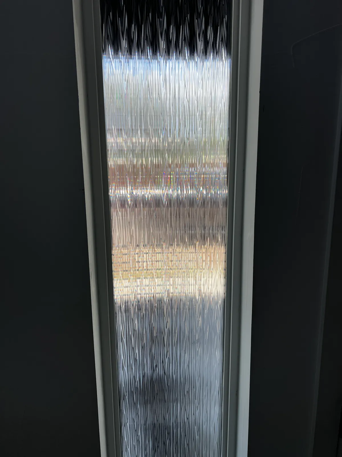 Decorative privacy window film installed on a narrow window in a Northern Colorado home