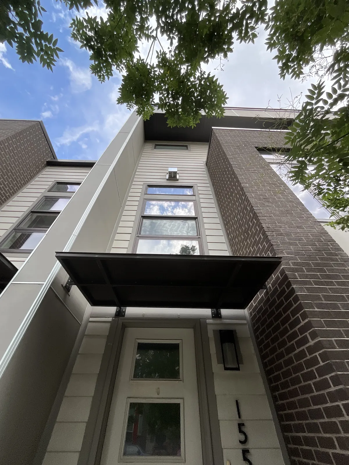 Exterior window cleaning on a multi-story townhouse in Northern Colorado
