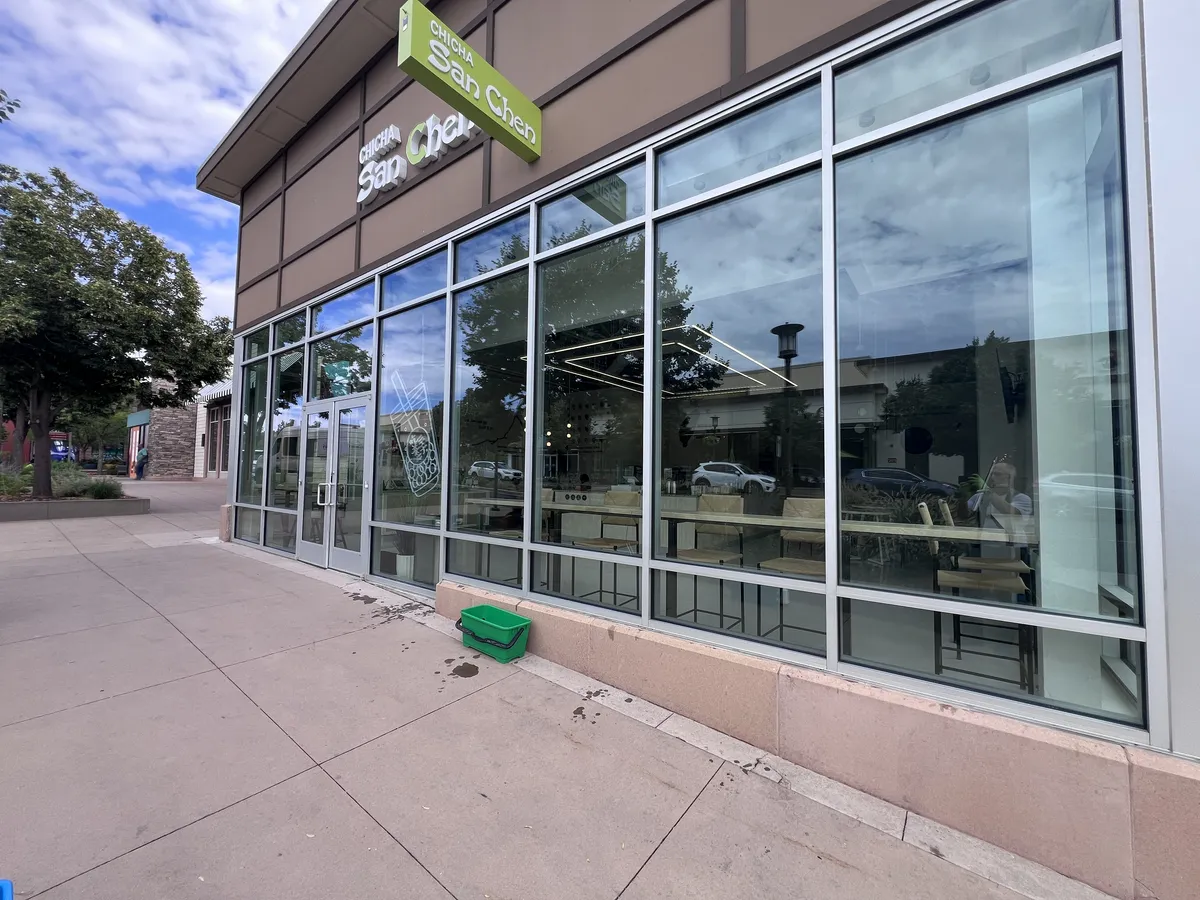Commercial storefront window cleaning on a retail building in Northern Colorado