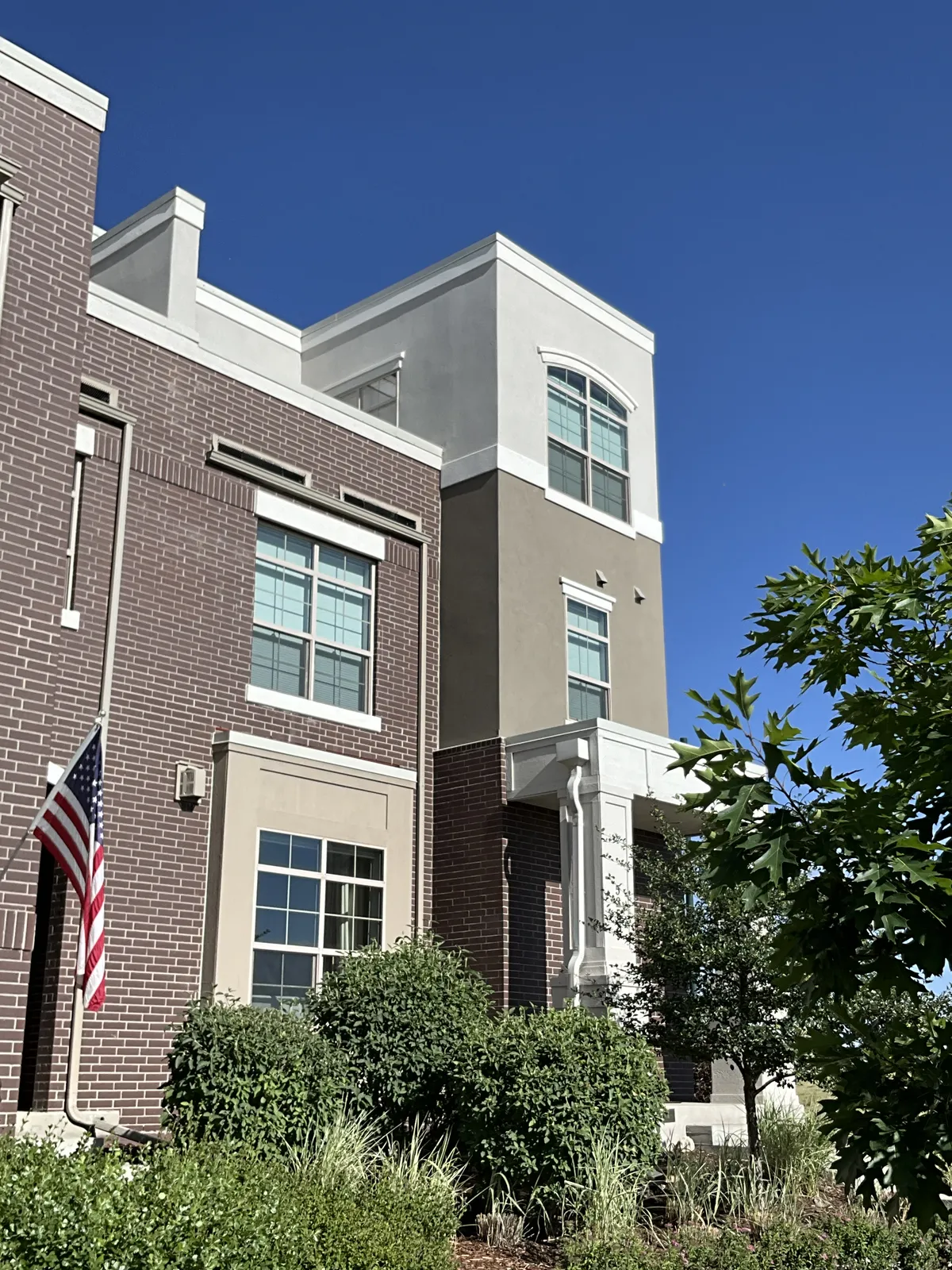Window cleaning on a three-story brick townhome in Northern Colorado