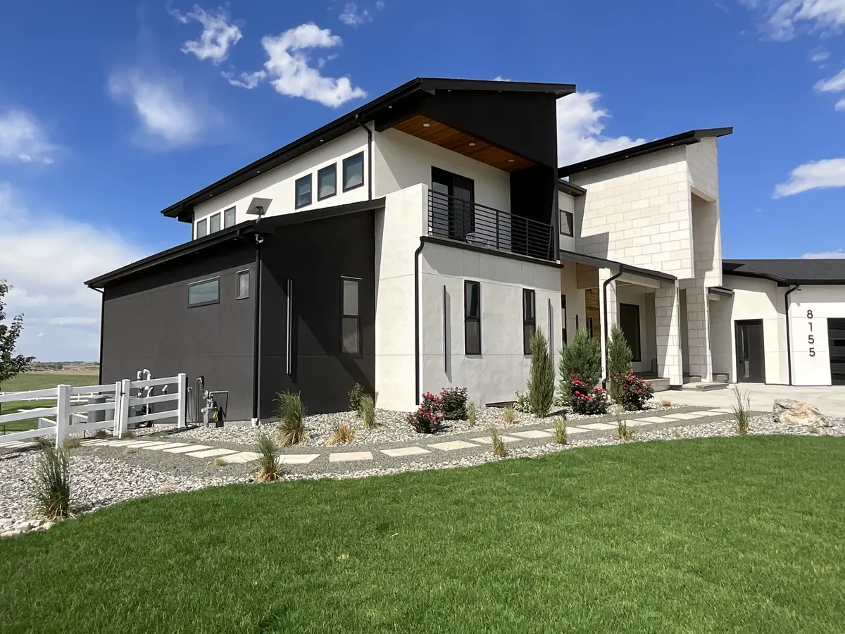 Residential window cleaning on a modern two-story home in Northern Colorado