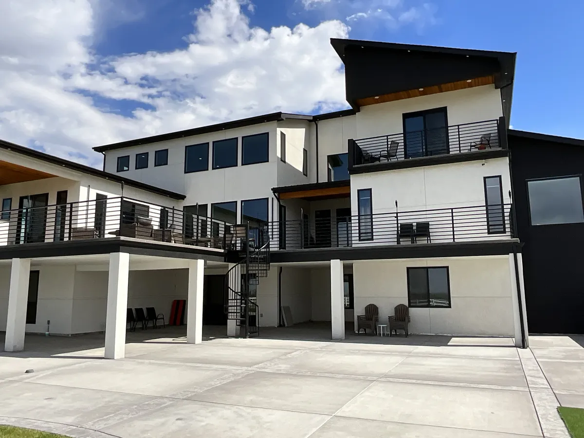 Window cleaning on a large three-story home with walkout decks in Northern Colorado