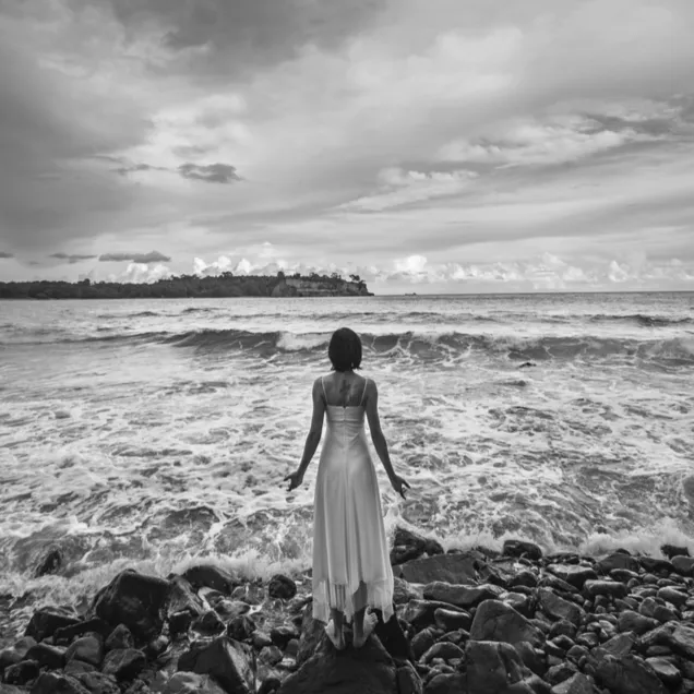 Woman practicing somatic breathwork in peaceful environment