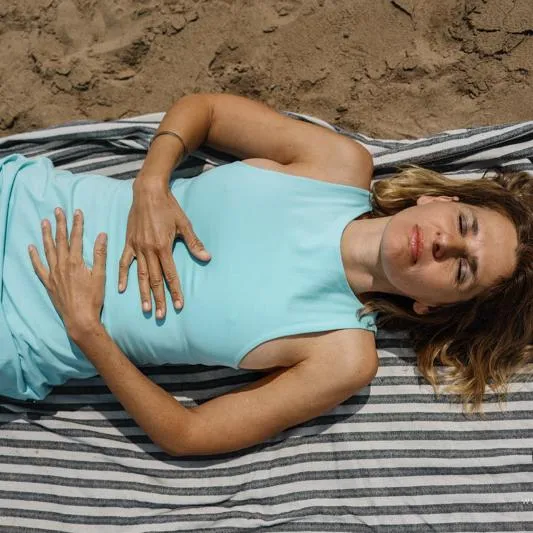 Woman experiencing deep relaxation during breathwork session