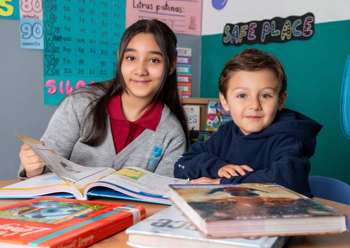 man in yellow button up shirt standing beside man in black shirt