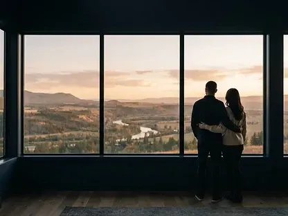 couple looking out the window into the land