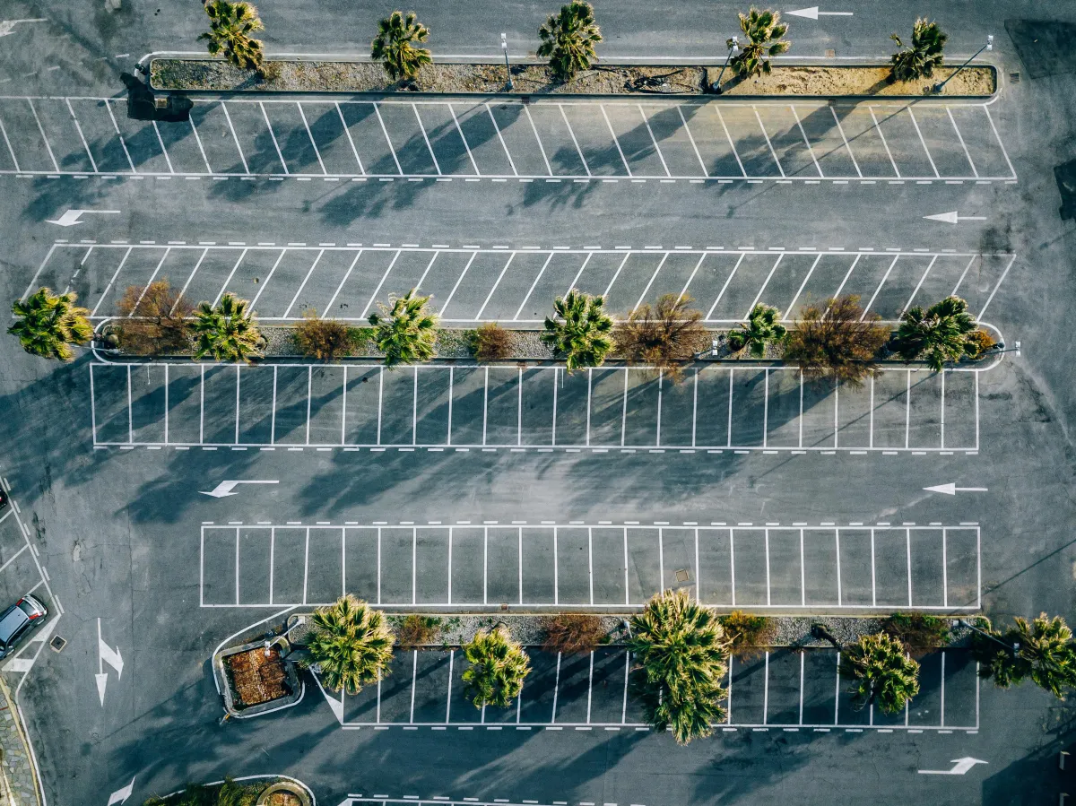 man standing beside freeway road