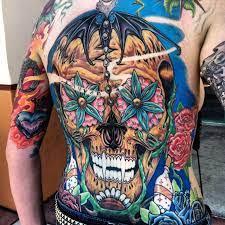 Skull tattoo, vampire teeth tattoo, colorful tattoo, flower tattoo back or chest tattoo Las Vegas