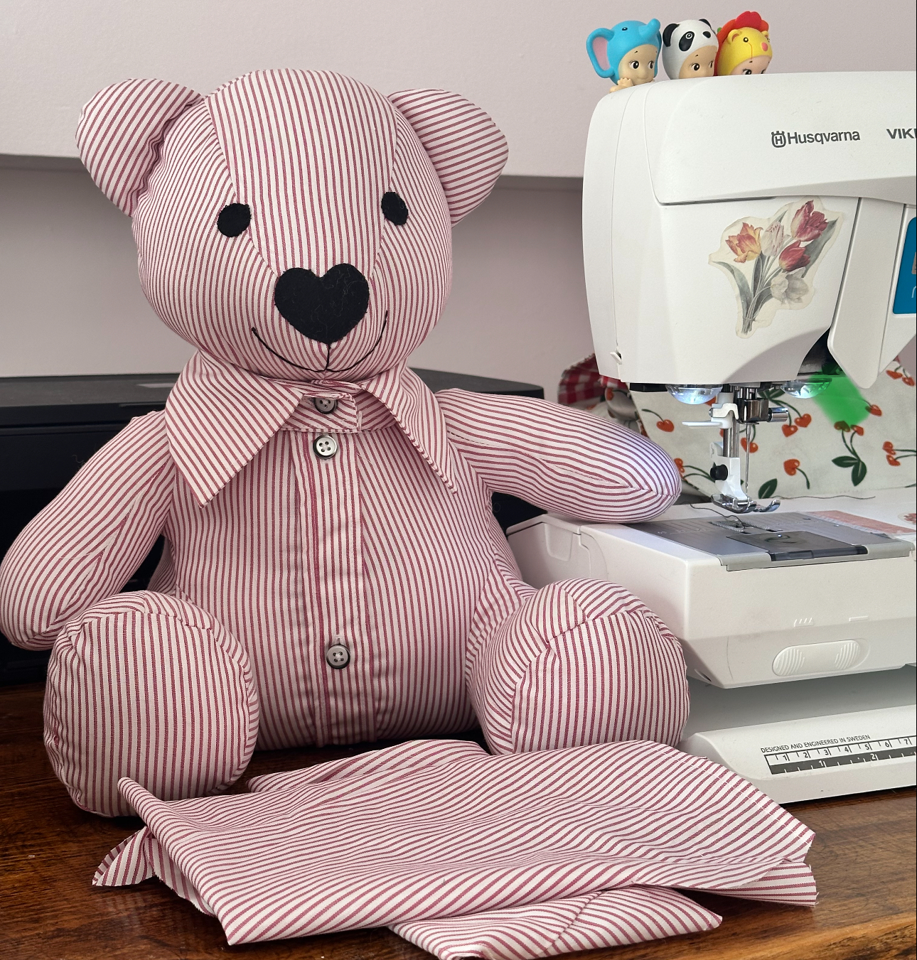 A brown teddy bear is posing for the camera.