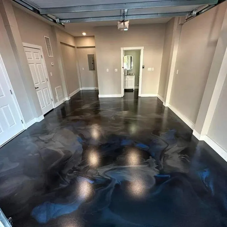 professional applying epoxy floor coating in Evergreen using industrial-grade roller