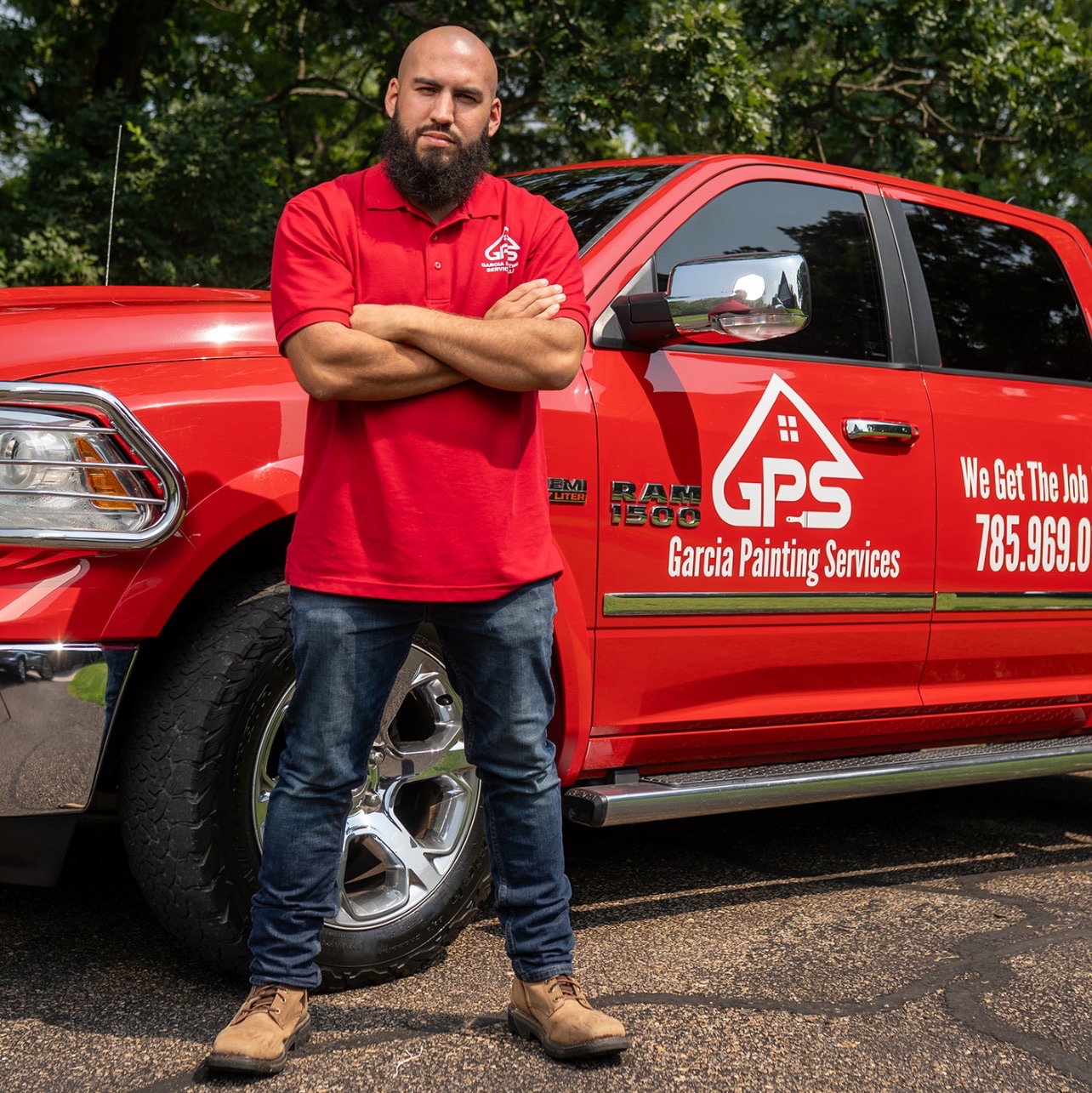 a woman sitting on a couch looking at a laptop