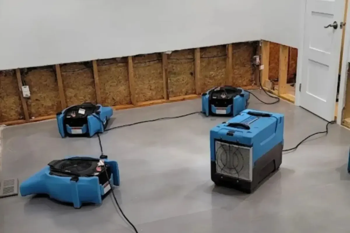 Water damage basement with drying fans