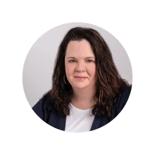 Headshot of Kristy Crippen in a white shirt and dark blazer, Founder of Collaborative Partners