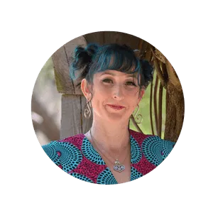 Headshot of Tricia Camacho, founder of Creative Costume Academy, wearing a bold patterned shirt with magenta and teal blocks.