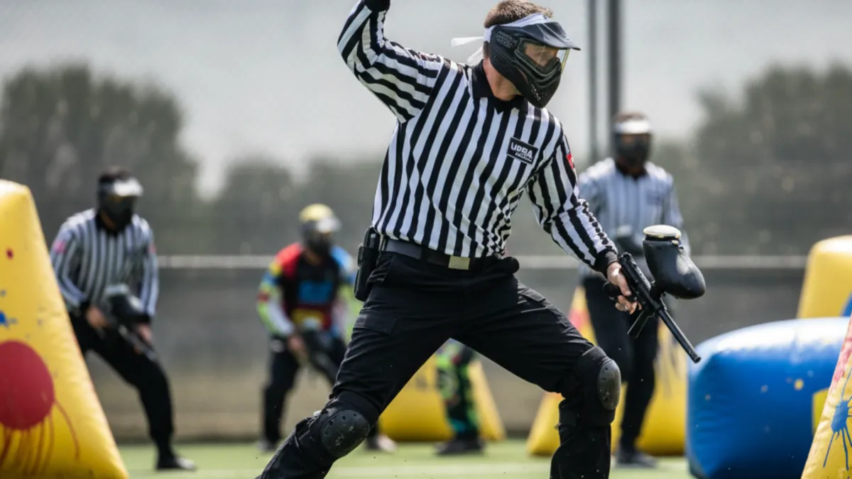 person standing in the peak of mountain range