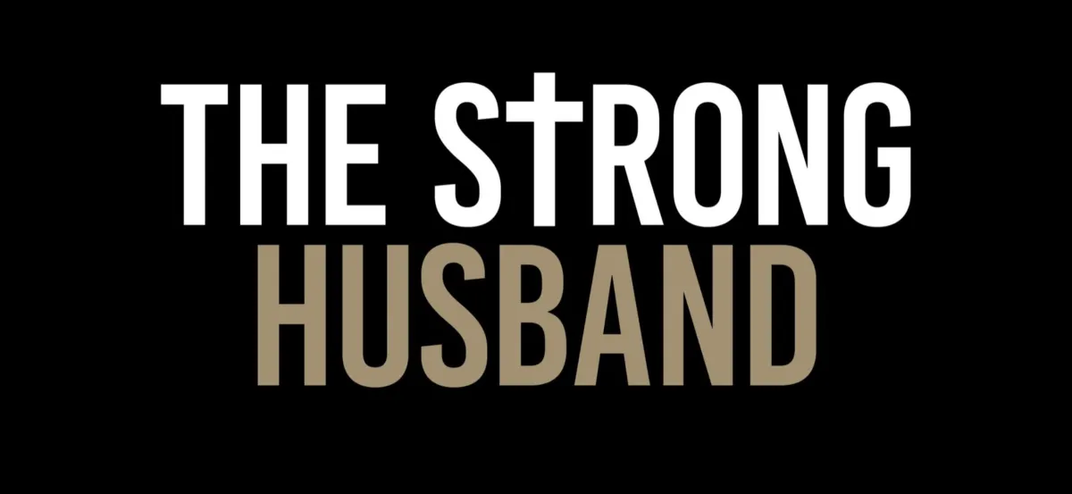 Text logo 'THE STRONG HUSBAND', styled with thick blocky white letters on a dark background.