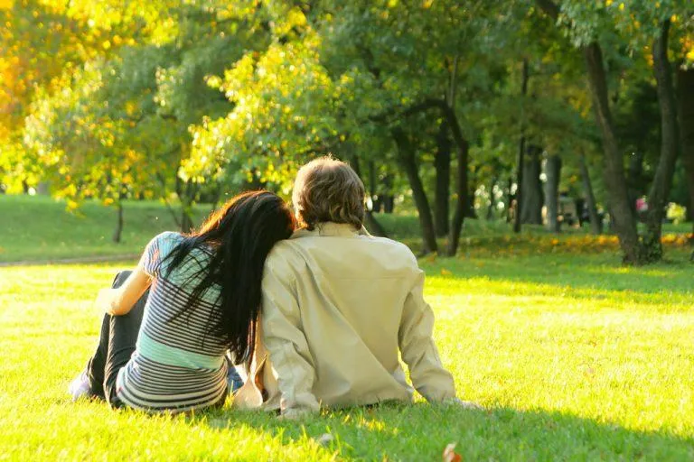 alt="a couple enjoying a sunny day in the park"