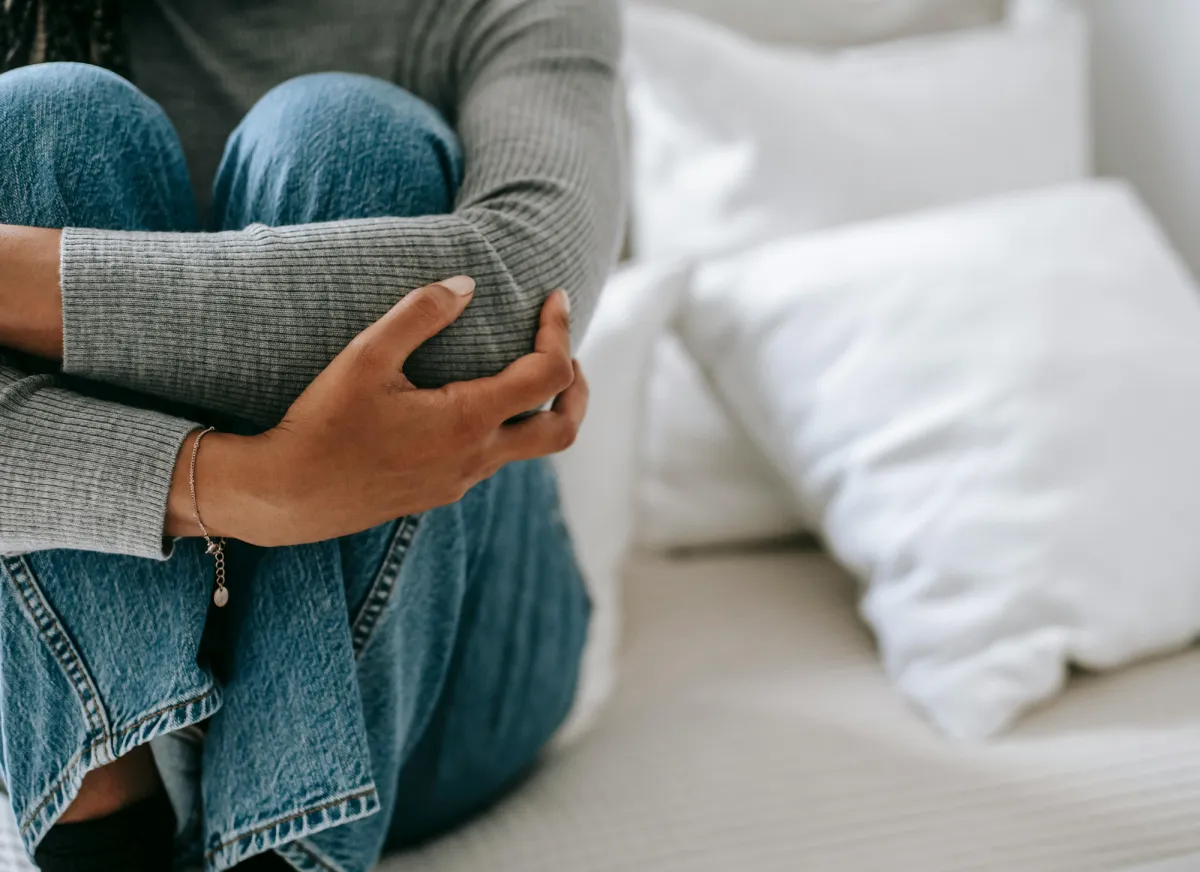 a person trying to hold it together, comforting themselves