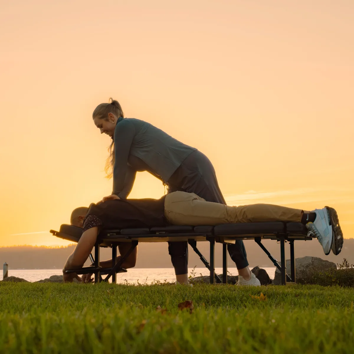 Dr. Jenna Brammeier D.C. giving chiropractic adjustment to an employee