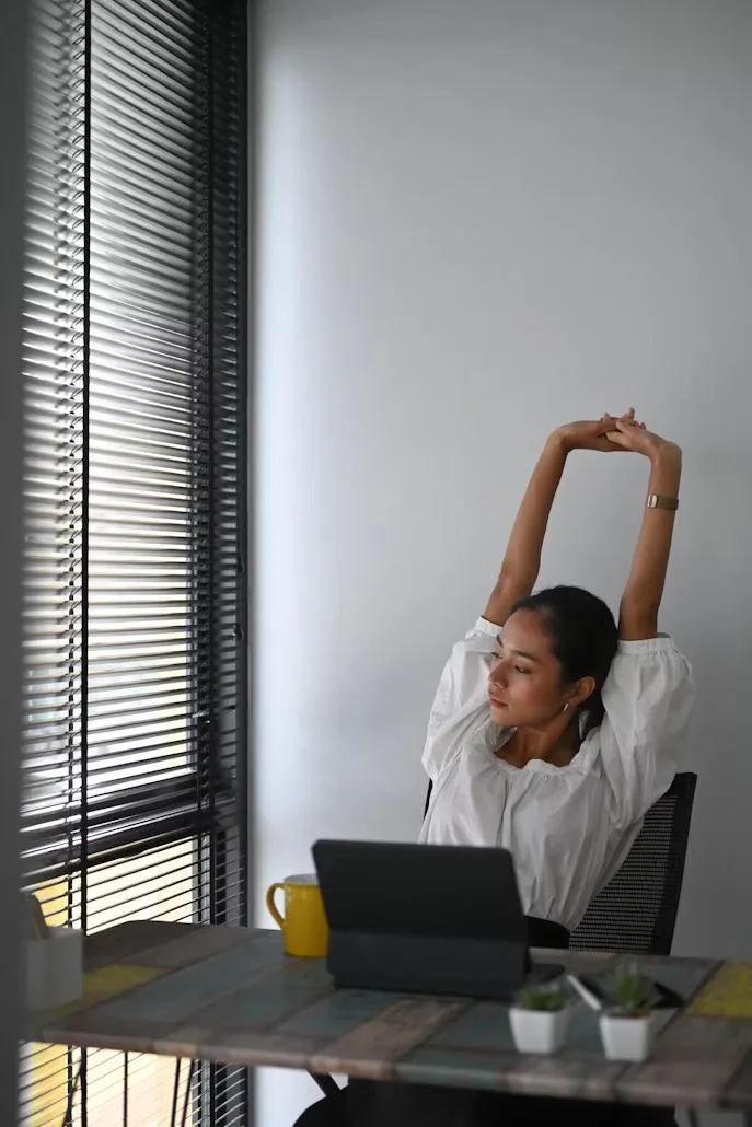 Employee sitting reviewing her ChiroFlex benefits