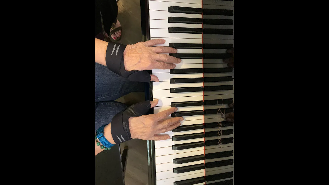 adult arthritis hand playing piano