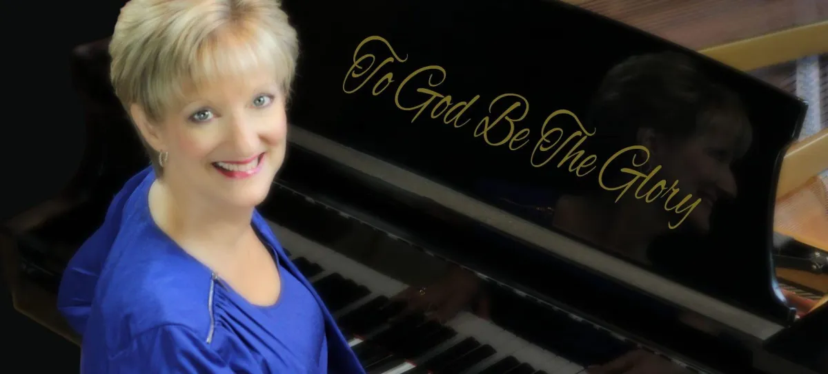 Rebecca sitting at the piano - To God Be The Glory!