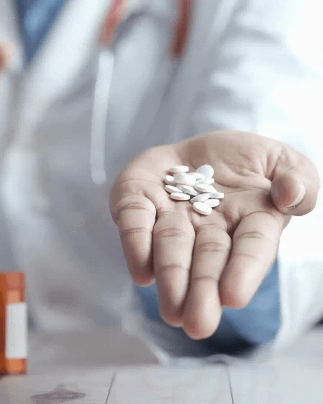 doctor offering prescription pills for neuropathy treatment