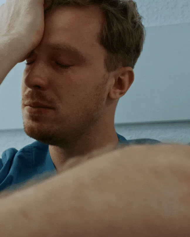 man in his 30s or 40s experiencing neuropathy pain and stress