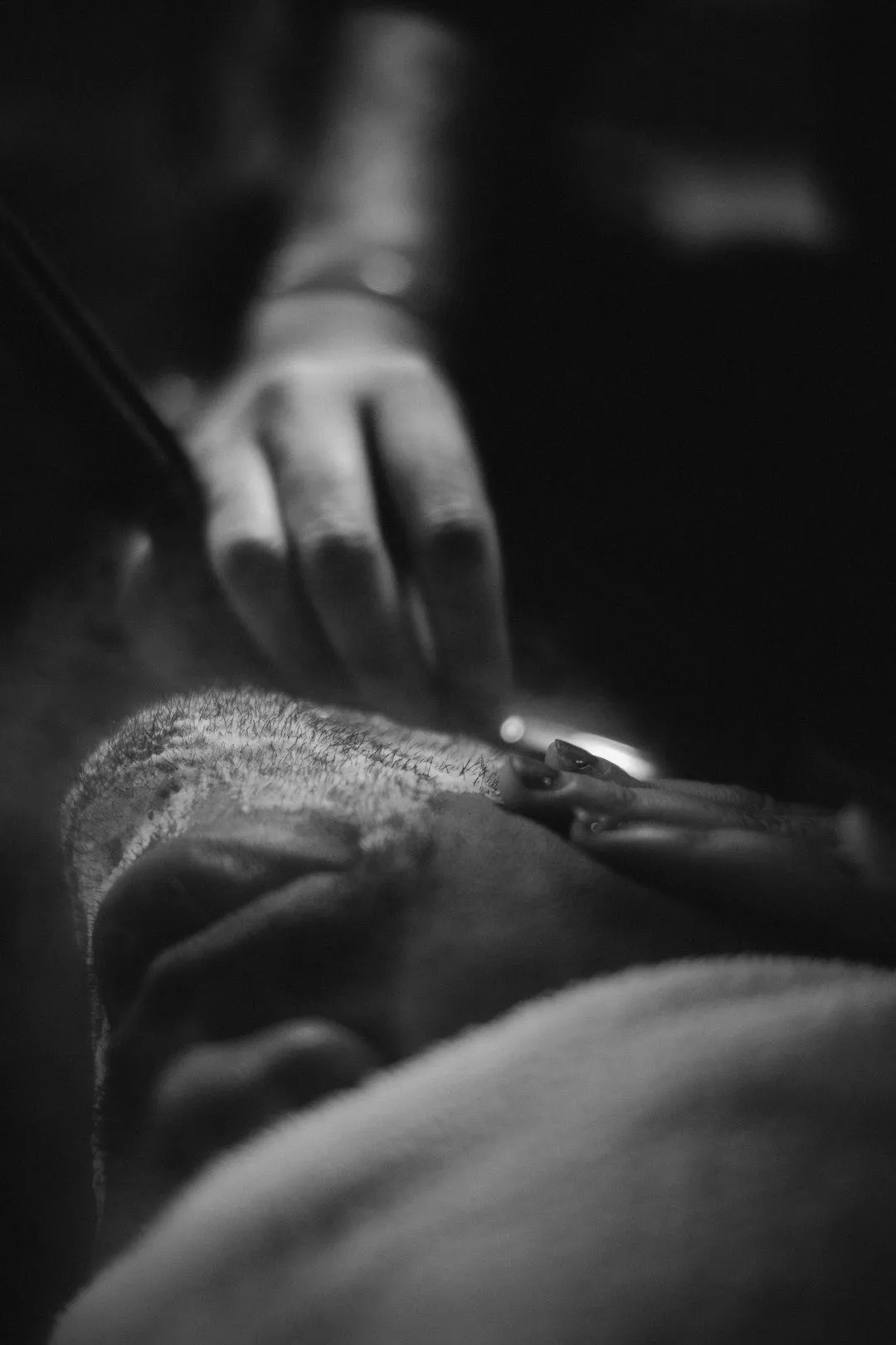 woman talking through mobile phone while sitting on swivel armchair