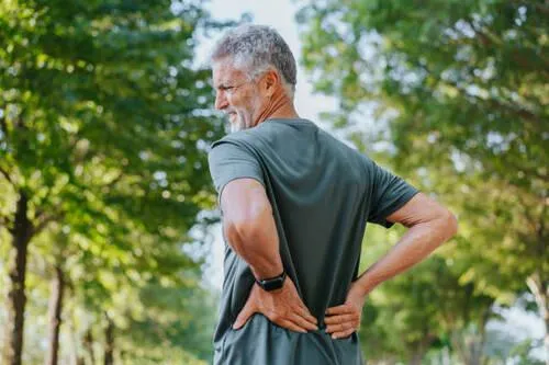 An elderly man with low back pain