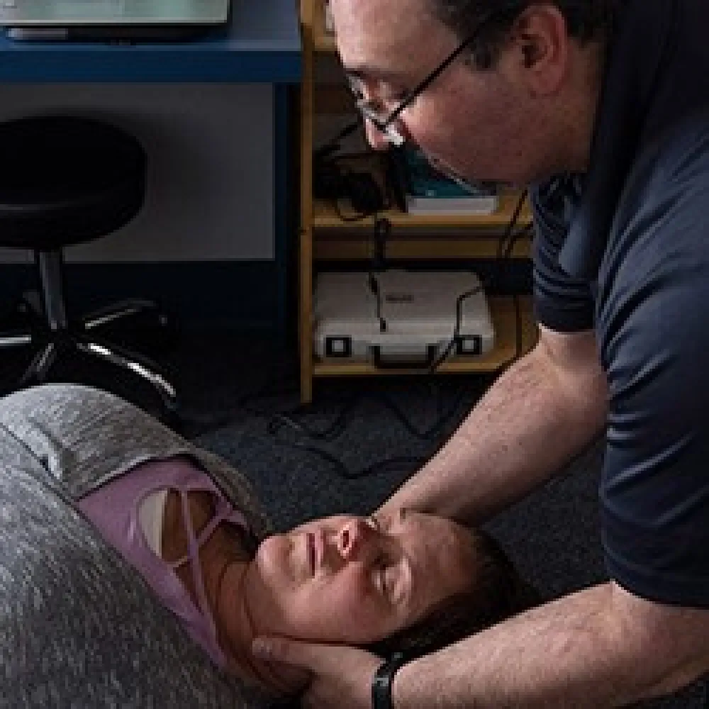 Chiropractor helping a patient relieve pain