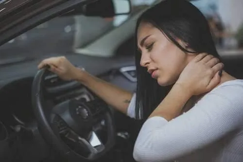 A lady with auto accident experiencing whiplash