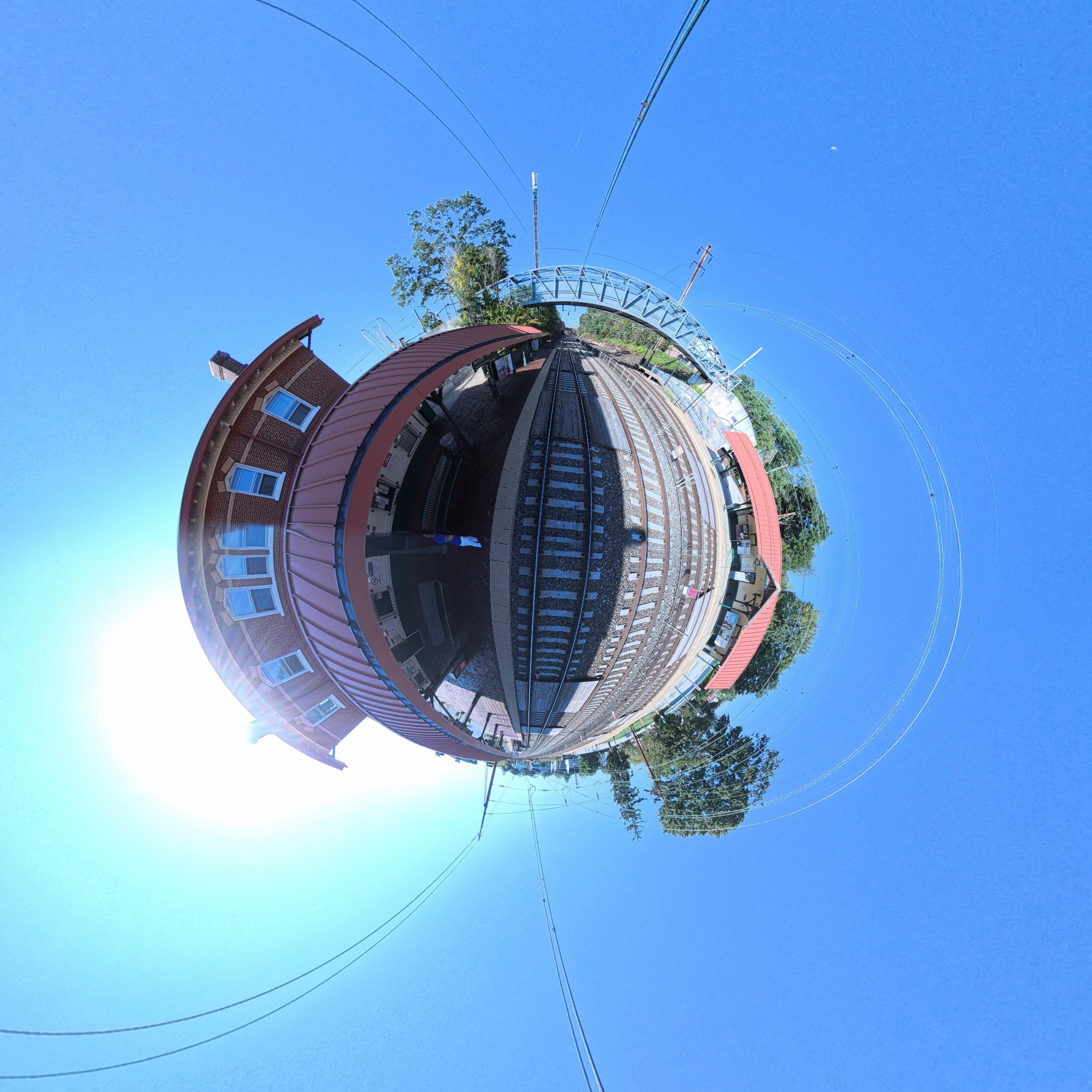 Traveler standing on a cliff overlooking the ocean at sunset