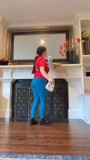 Employee cleaning a mantle