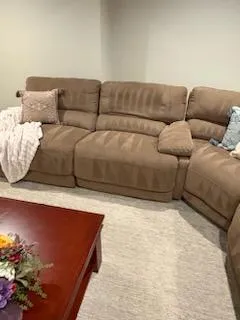 a little boy and a little girl playing in a living room