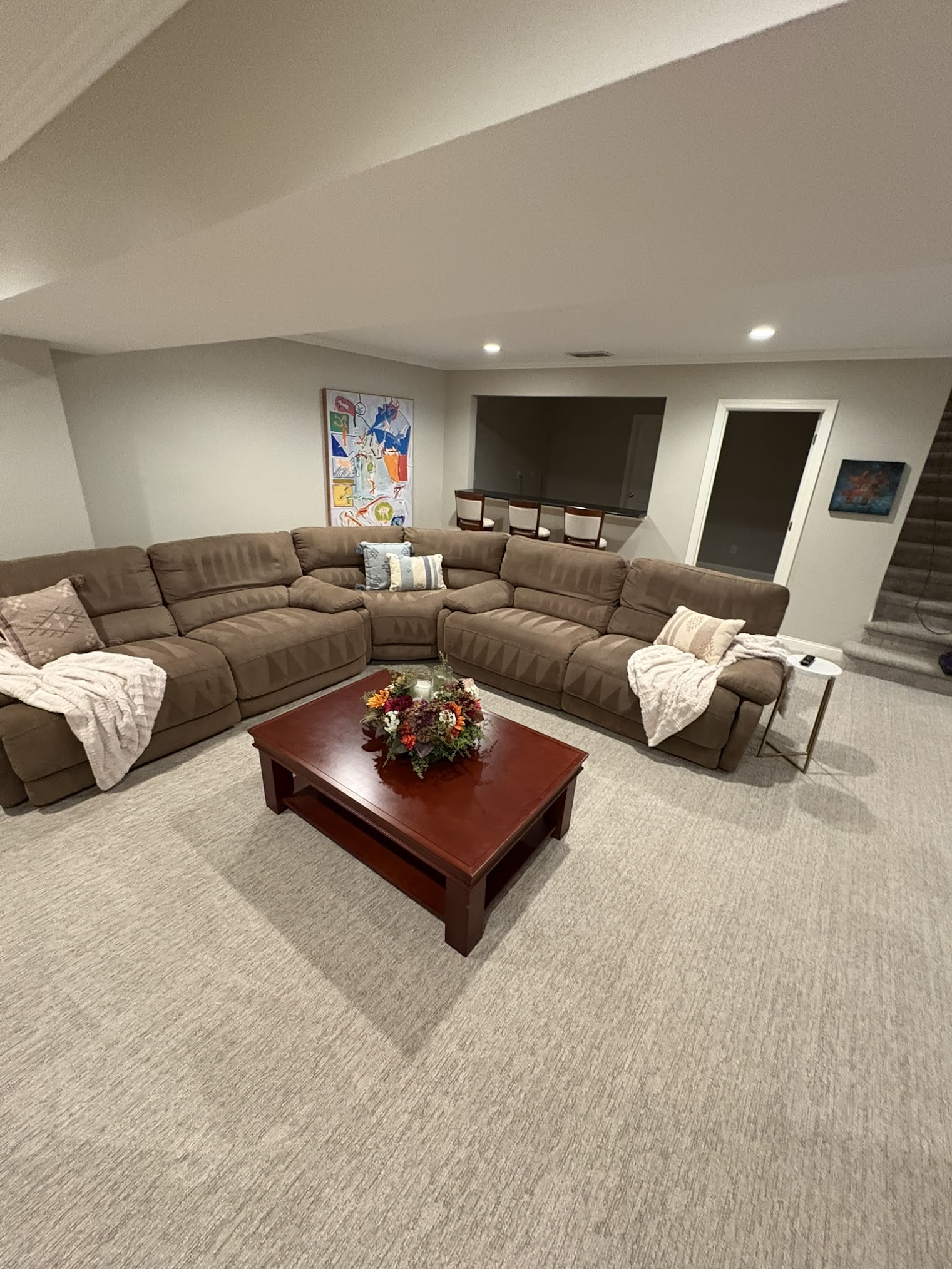 a little boy and a little girl playing in a living room