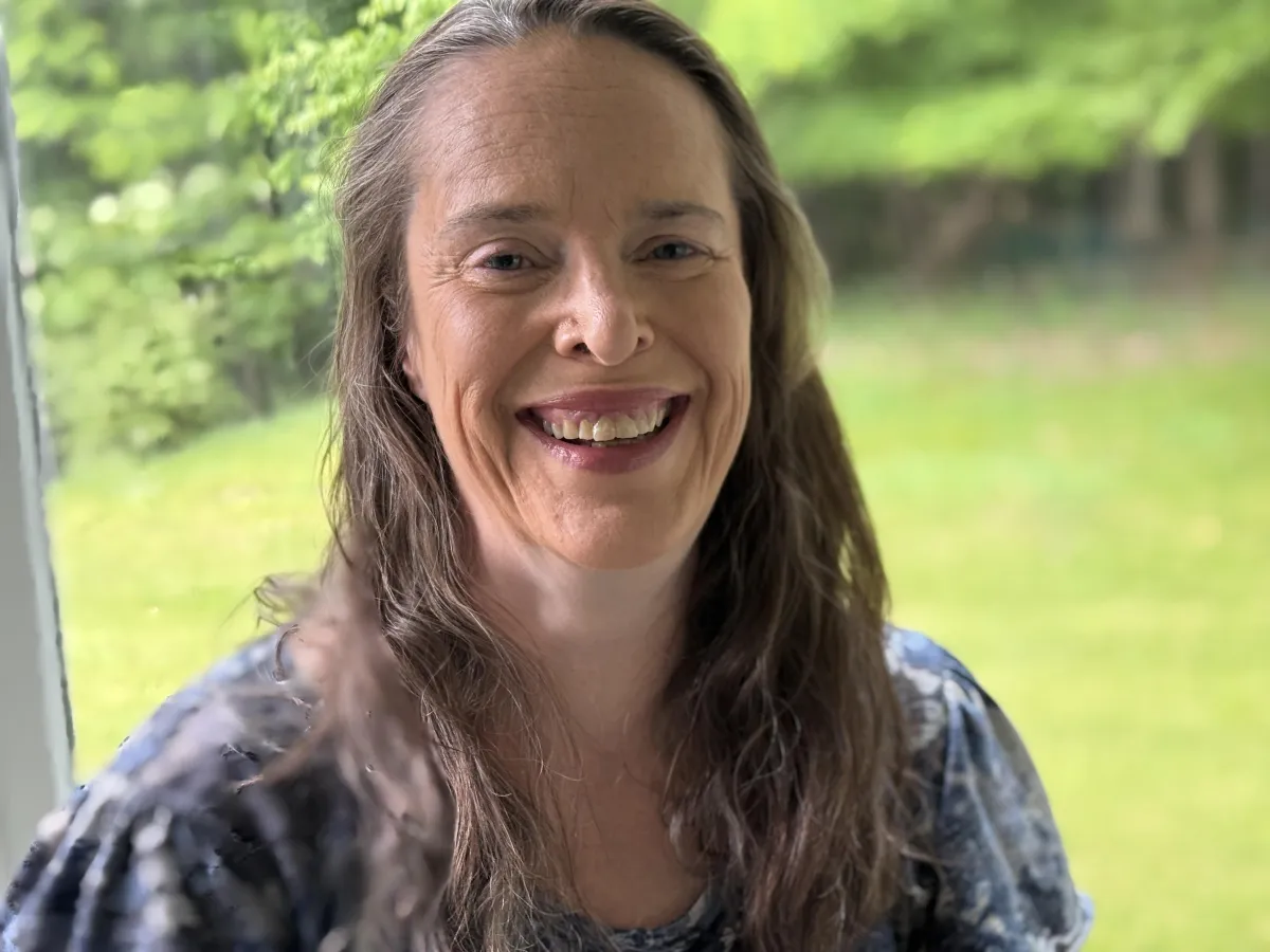 Picture of Tammi, Zoom Doggos founder, laughing