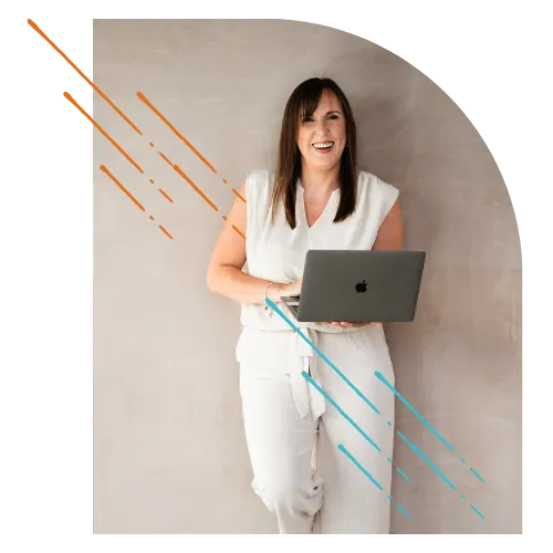 Lisa Tennant laughing holding a laptop