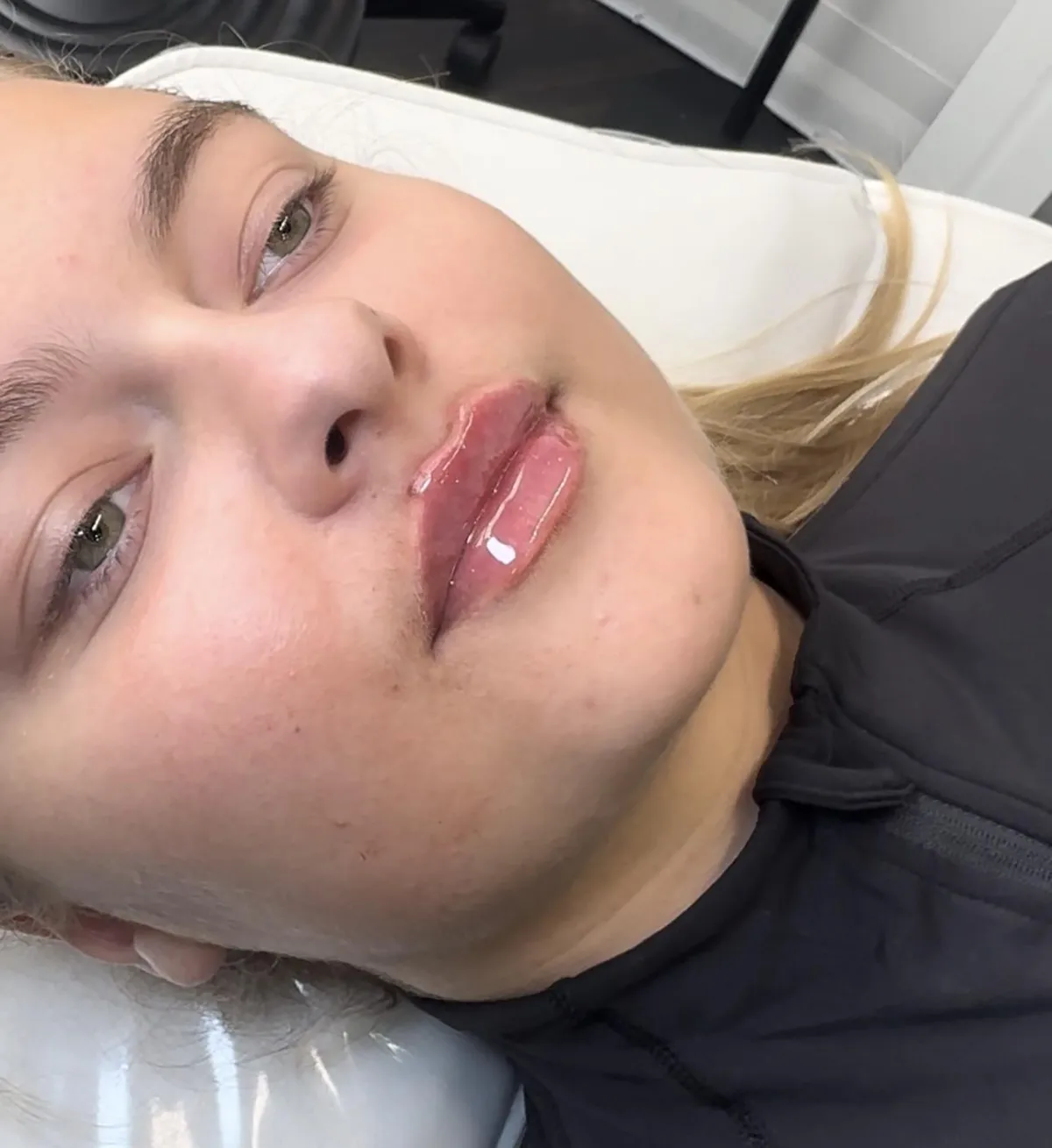 a living room with a couch and a window