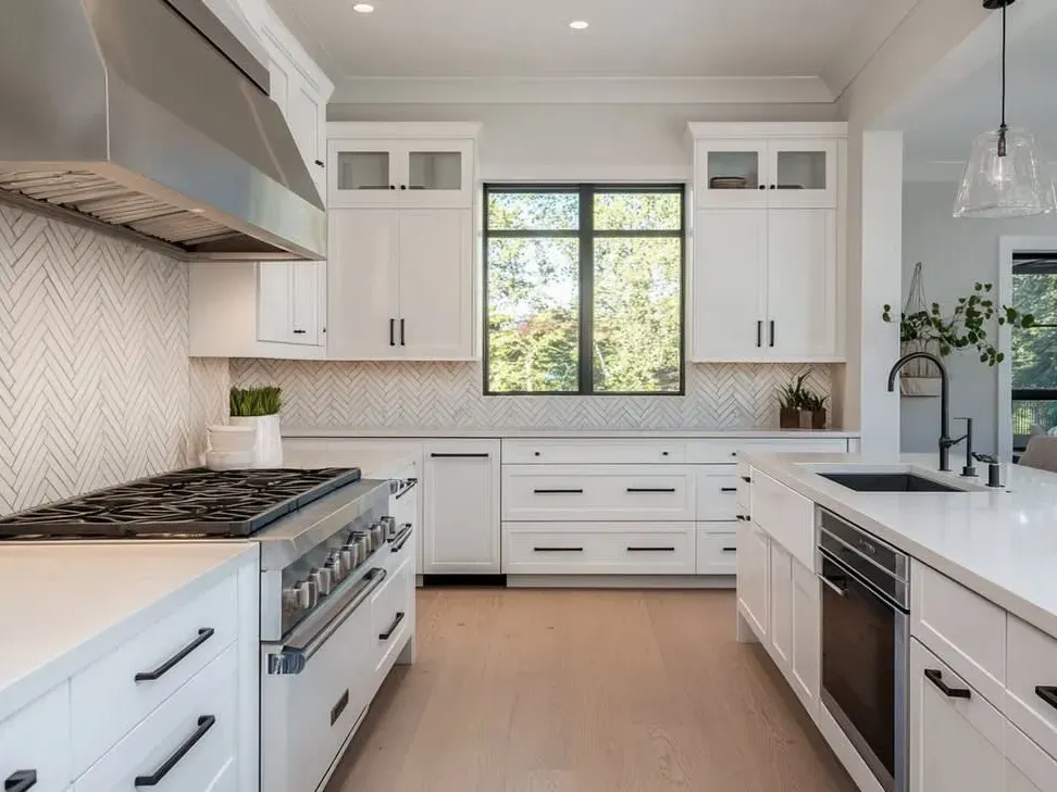 Modern Vista kitchen with warm wood cabinets quartz countertops stainless steel appliances hardwood flooring and panoramic outdoor view