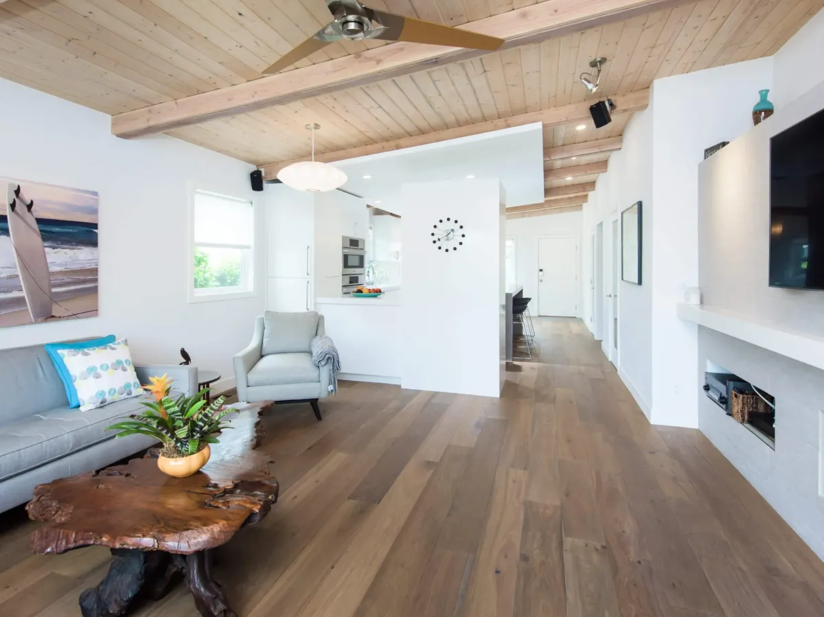 Modern kitchen remodel in Vista, CA featuring quartz countertops, stainless steel appliances, and oak cabinetry.