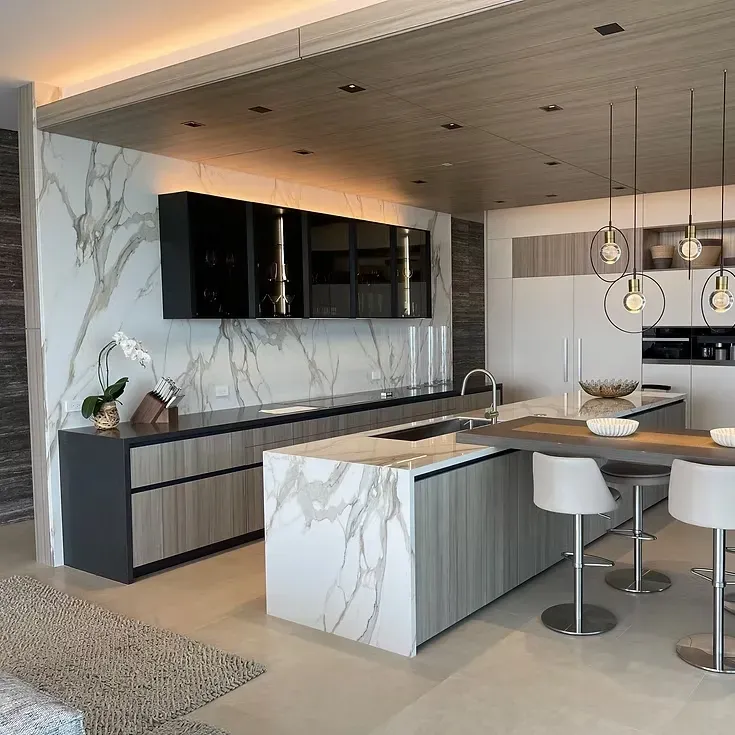 Custom modern kitchen in Vista California with sleek cabinetry, quartz countertops, stainless appliances, island, and natural light