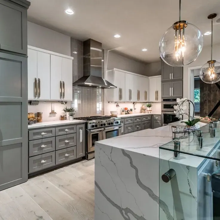 Beautiful modern kitchen renovation in Vista California with sleek cabinetry quartz countertops and lush outdoor view