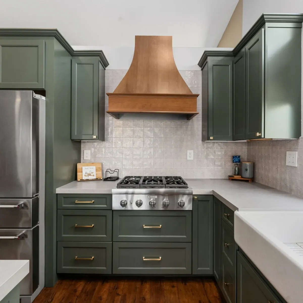 Modern neutral-toned Vista kitchen with sleek matte cabinets, open shelves, natural light, and stylish marble countertops