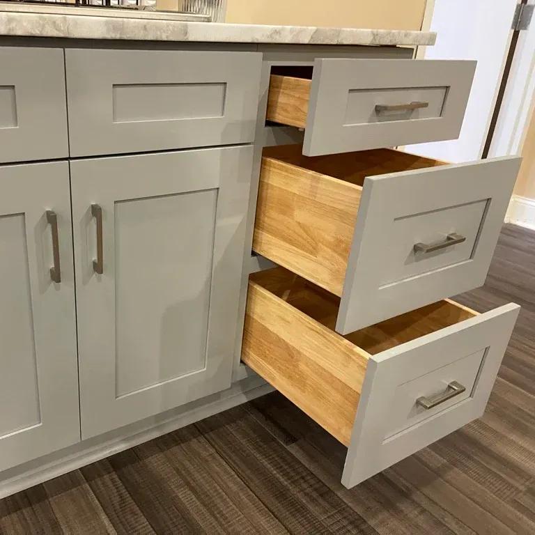 Beautifully finished modern RTA kitchen cabinets with natural wood textures, brushed nickel hardware, and a polished look in a bright, stylish space