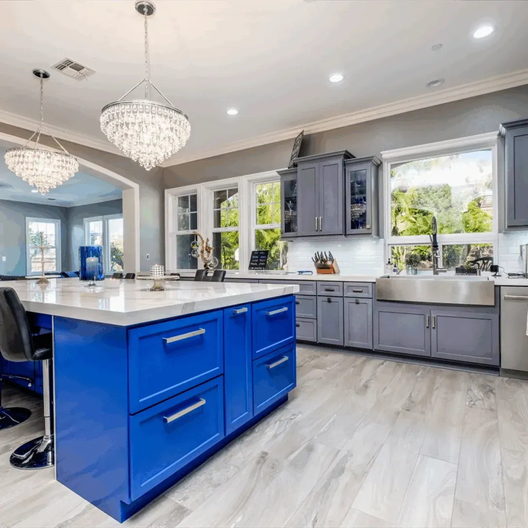 Freshly installed polished cherry wood custom cabinets in a modern kitchen with marble countertops and stainless steel appliances