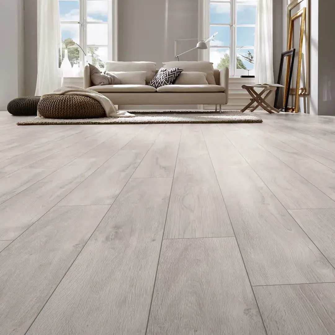Seamless laminate flooring with rich wood grain textures in a modern California interior with natural light and minimalist decor