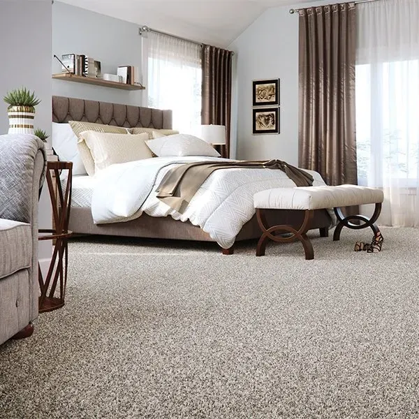 Perfectly installed plush patterned carpet in a modern living room with natural light and elegant decor in Vista California